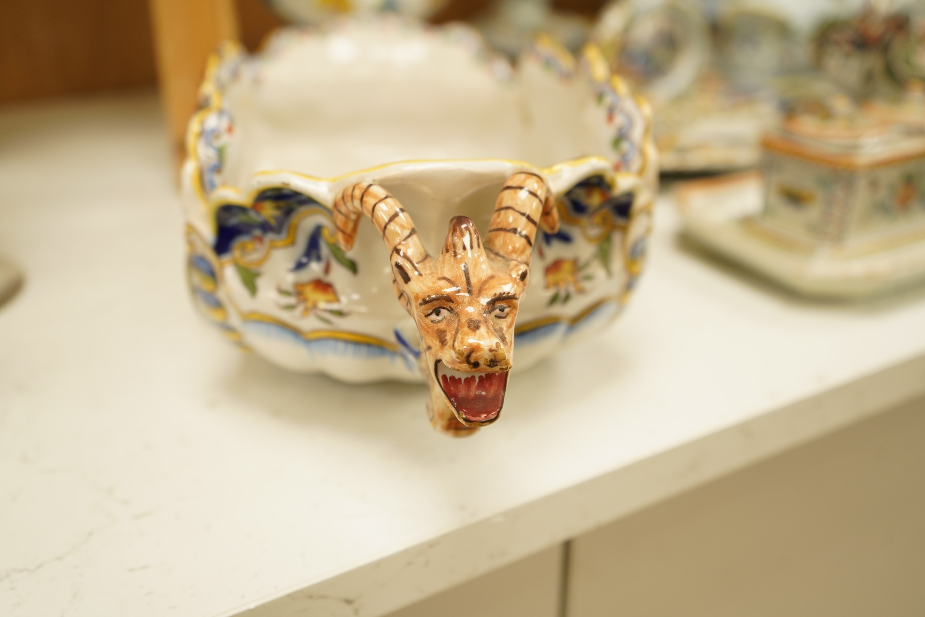 A collection of early 20th century French faience pieces To include dishes, an inkwell and a large ewer, 42cm high